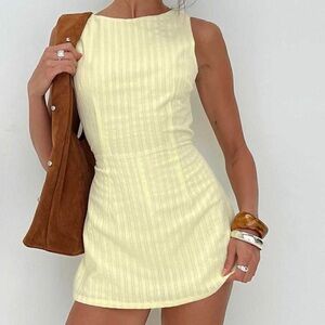 NWOT Yumiko romper yellow.